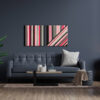 Rectangular Resin art with pink and color stripes on a grey wall with a great leather sofa in front