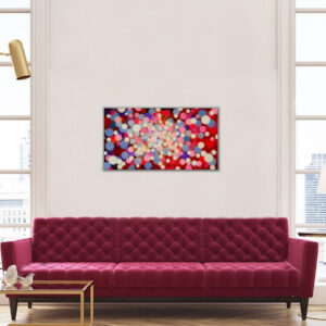 Rectangular Resin art with red and pink dots horizontal in a white room with a red sofa in front of it
