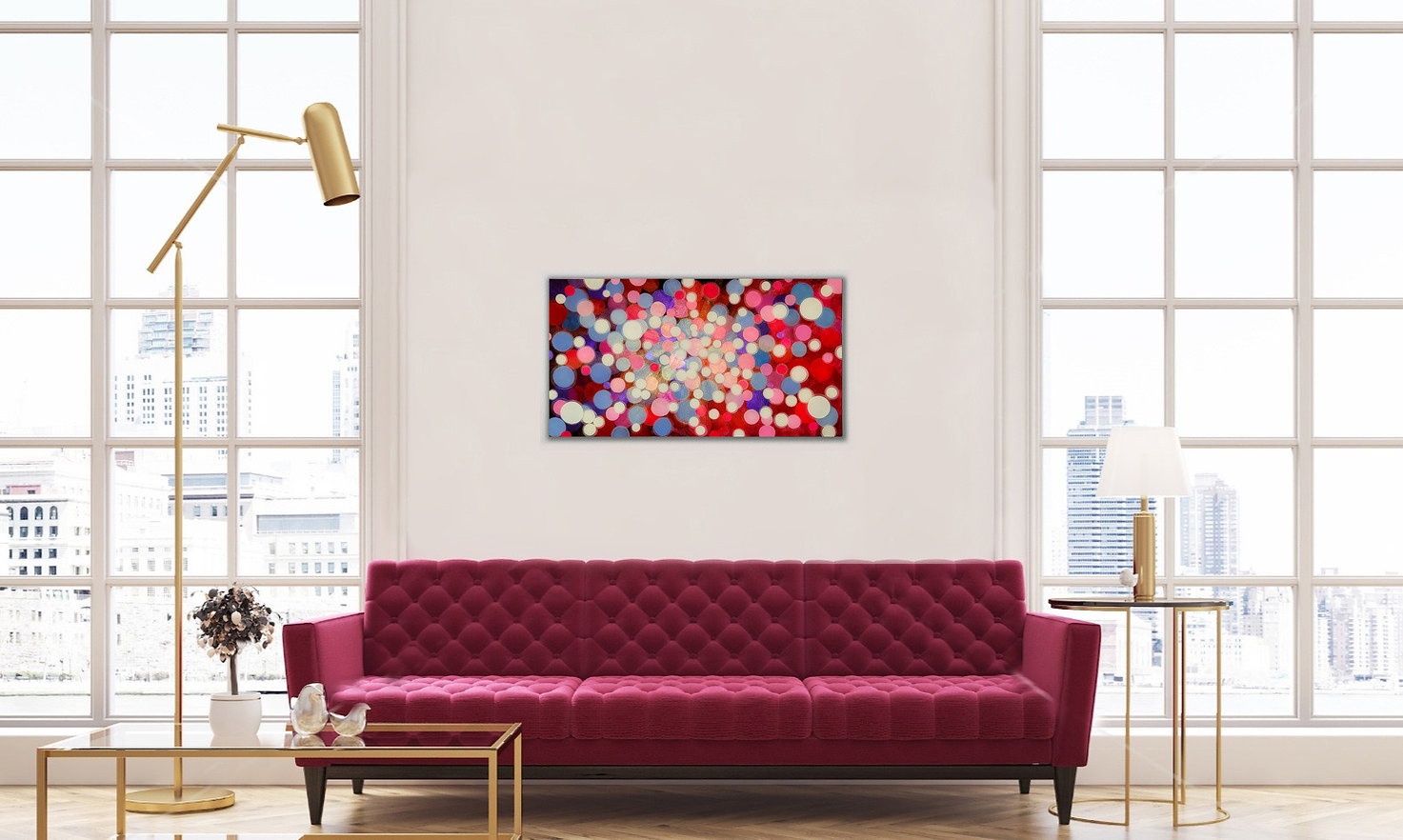Rectangular Resin art with red and pink dots horizontal in a white room with a red sofa in front of it
